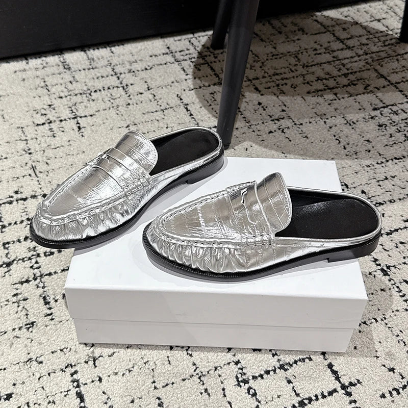 Women's leather penny loafer mule with flat heel in Black croc