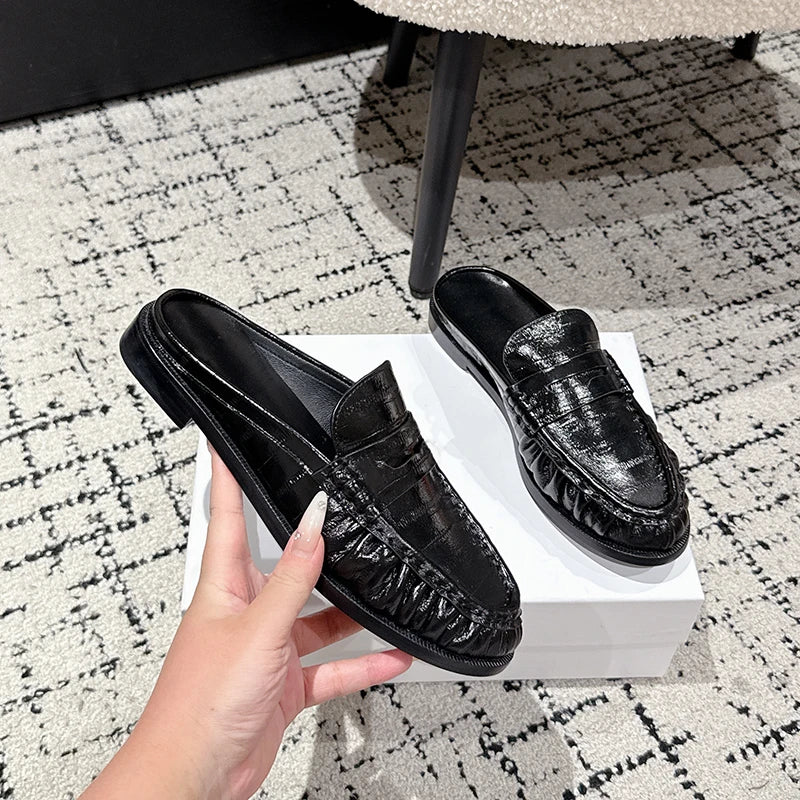Women's leather penny loafer mule with flat heel in Black croc