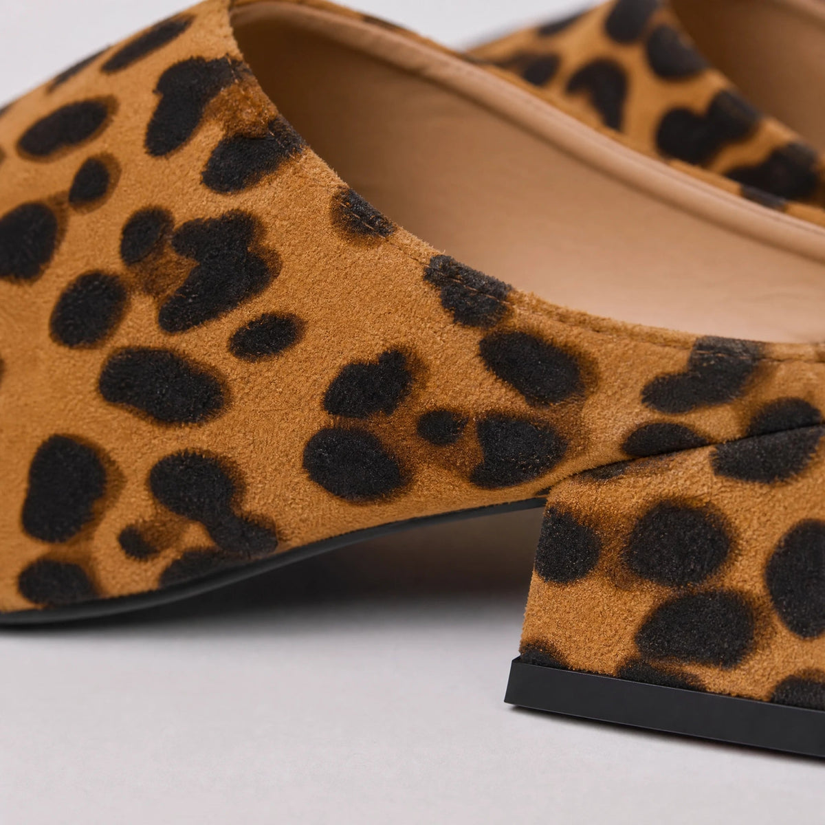 Women's leopard-print loafer mules with block heel, side view