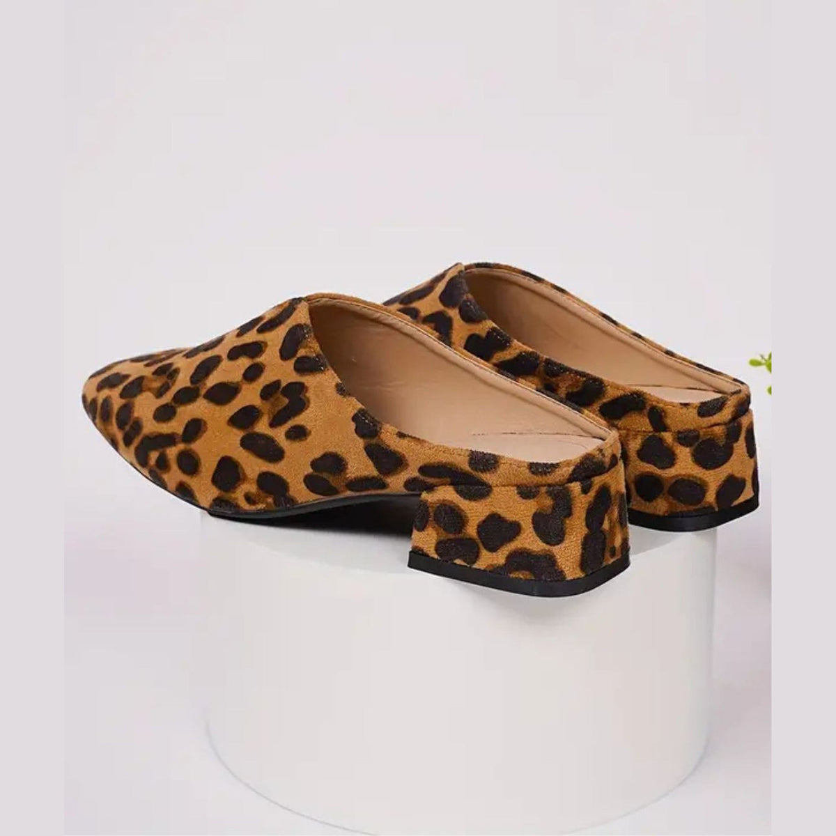 Women's leopard-print loafer mules with block heel, pair seen from above