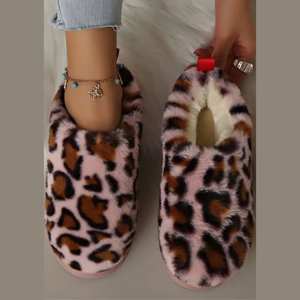 Leopard fur-lined mules worn with jeans