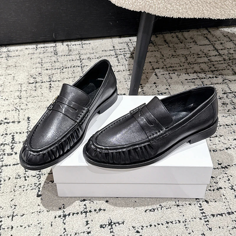 Women's smooth leather-look penny loafer with open heel in Black