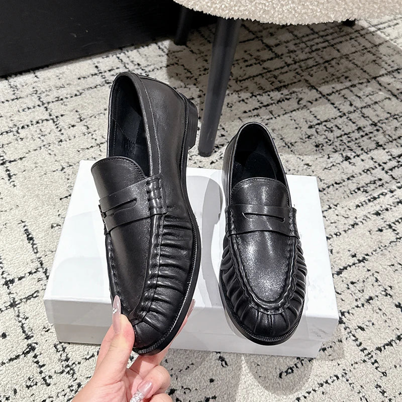 Women's smooth leather-look penny loafer with open heel in Cognac
