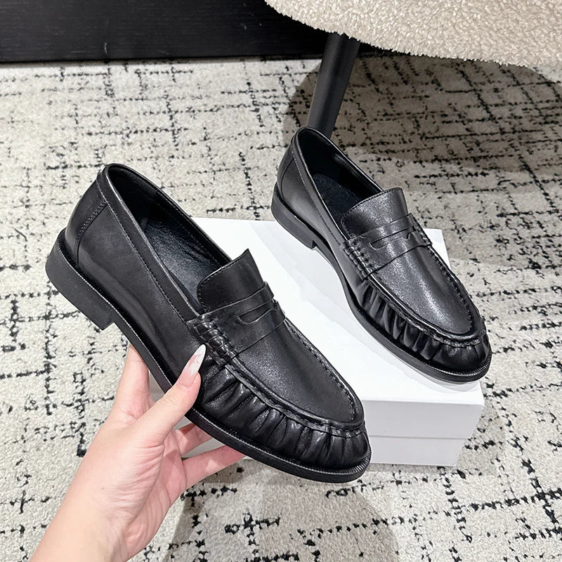 Women's smooth leather-look penny loafer with open heel in Brown