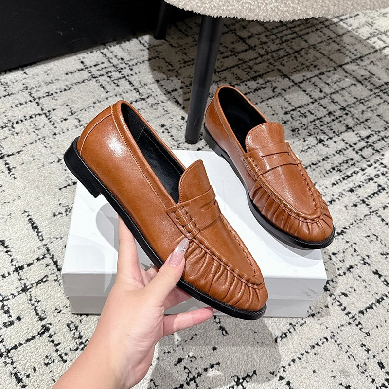Women's smooth leather-look penny loafer with open heel in Black