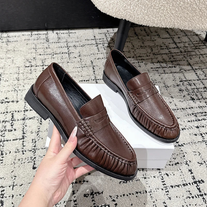 Women's smooth leather-look penny loafer with open heel in Cognac