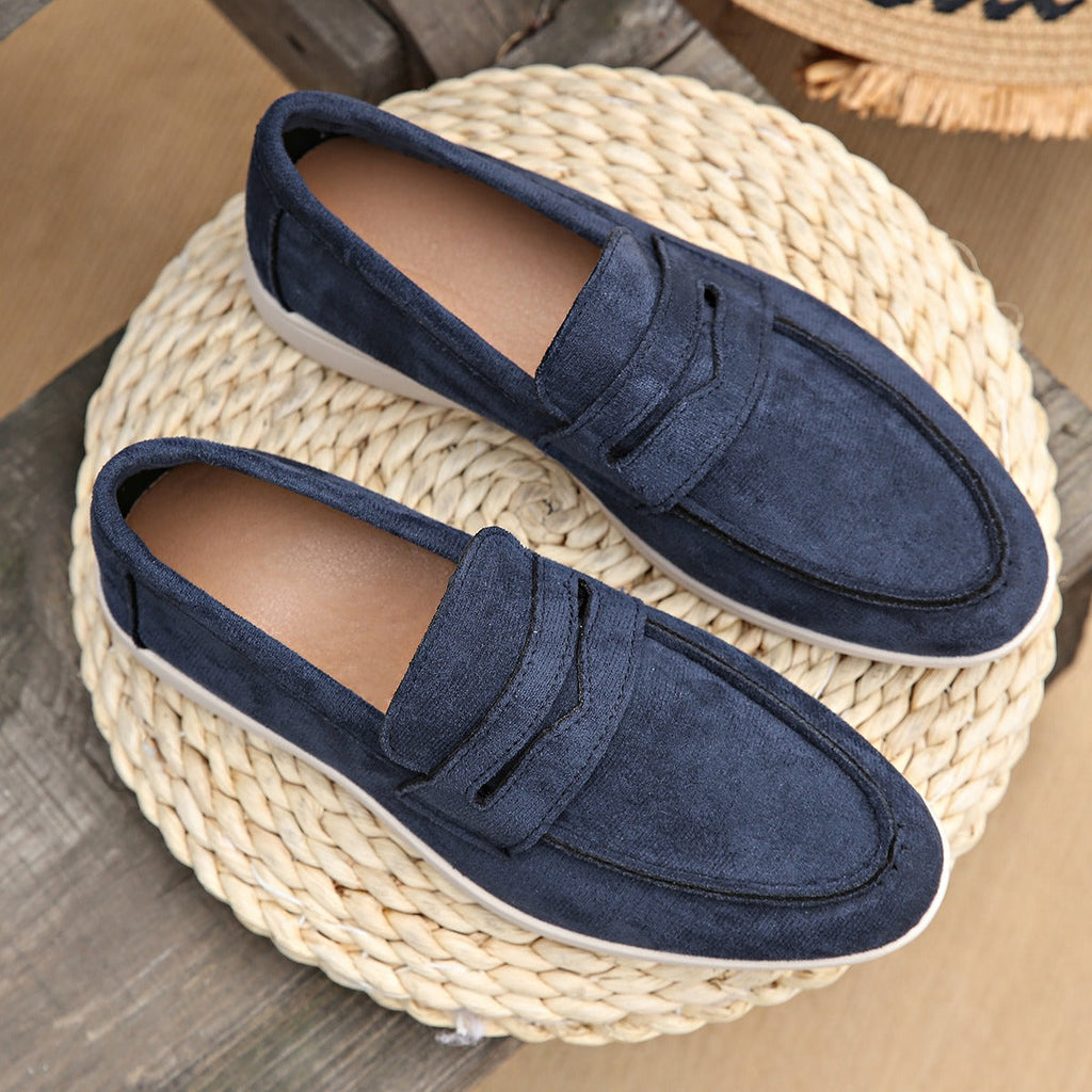 Women's strap loafer with white sole, navy pair seen from above