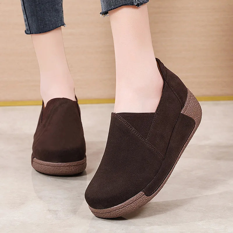 Women's suede leather loafers with thick sole in Black, worn view