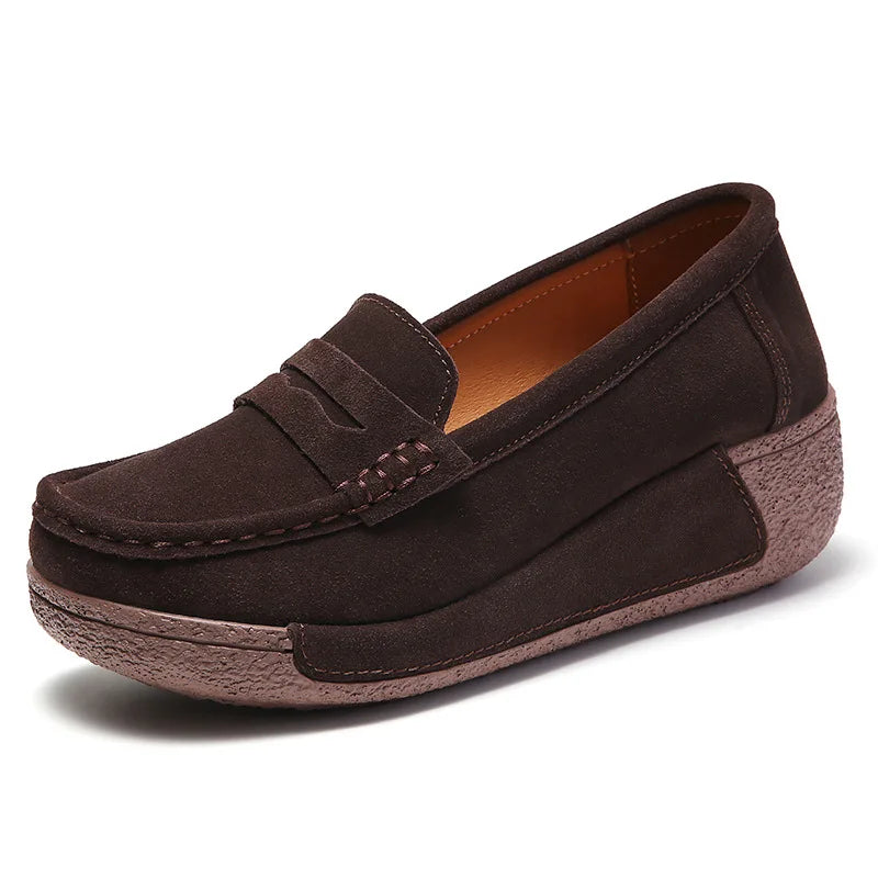 Women's suede wedge loafers with penny finish in Brown, worn view