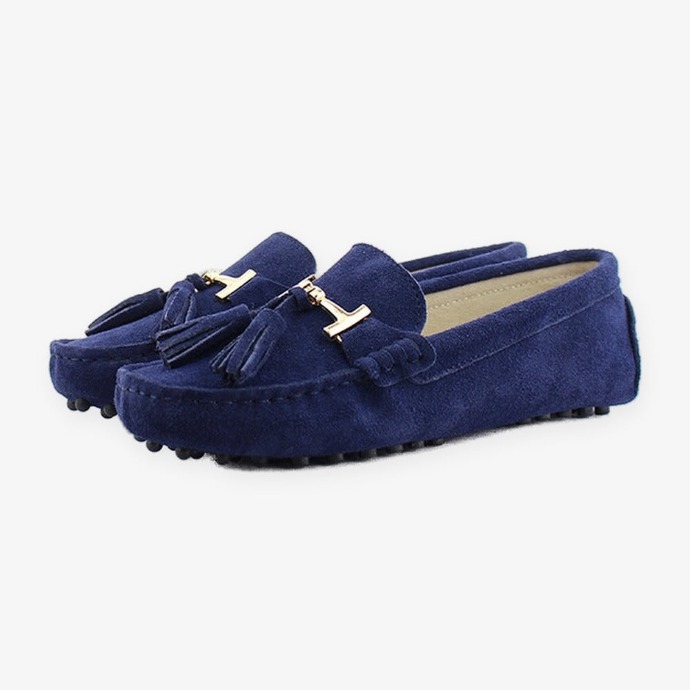 Women's leather tassel loafer with gold bit, light gray styled with an outfit