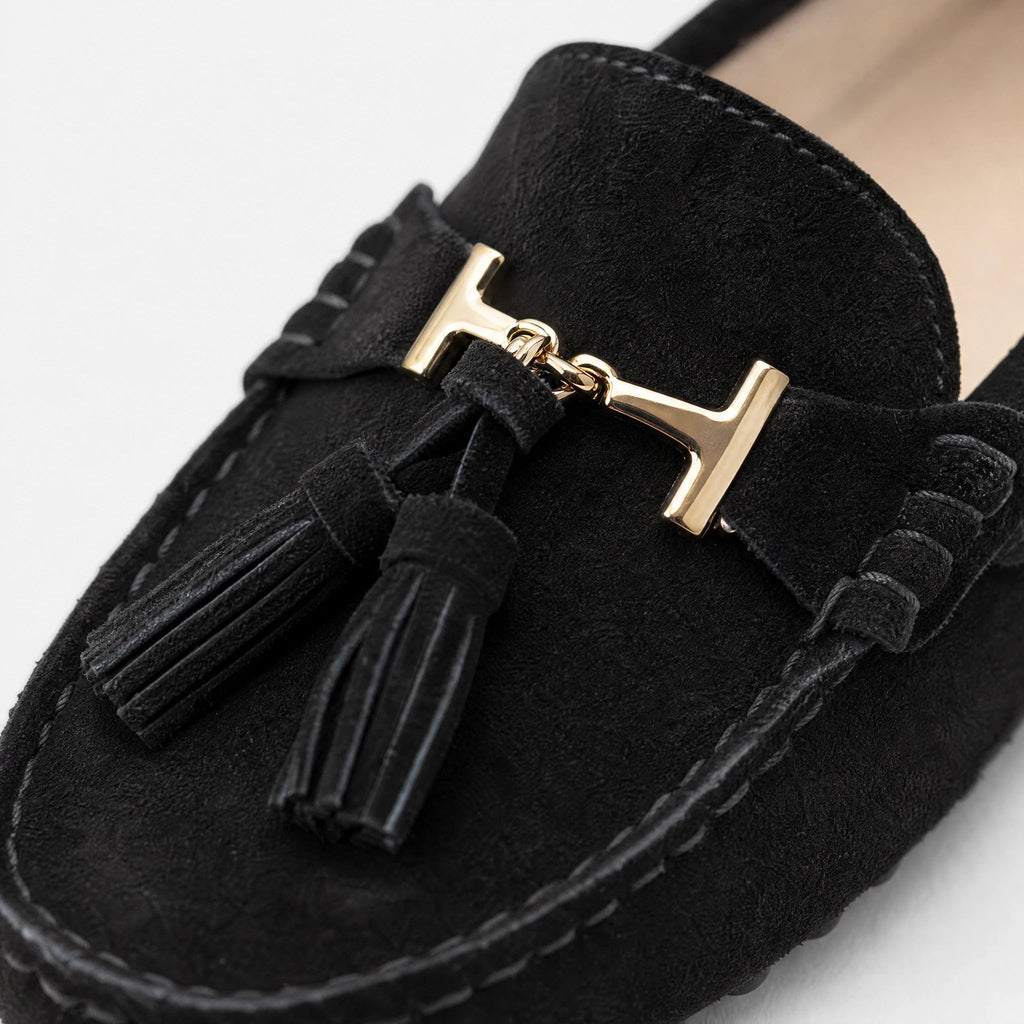Women's leather tassel loafer with gold bit, navy side view