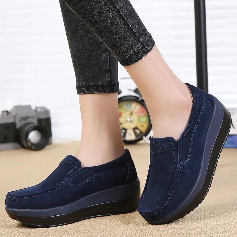 Women's two-tone platform loafers with thick sole in Navy Blue, worn view