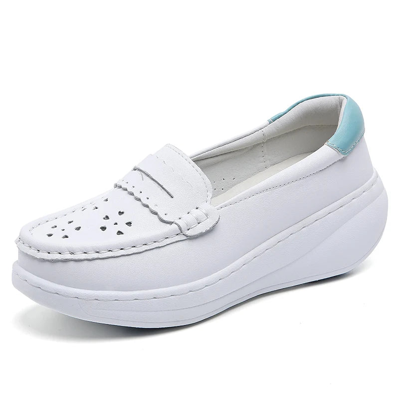 Pair of white perforated leather loafers