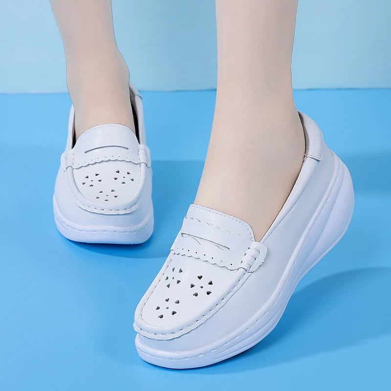 Perforated white leather loafer on platform sole