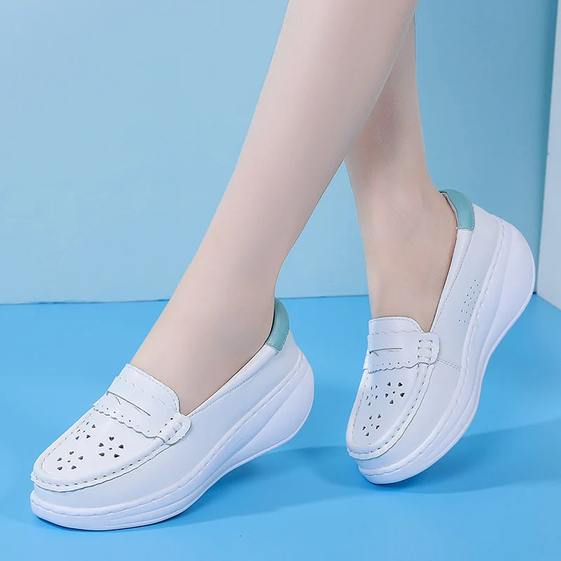 Back view of white loafer with colored heel