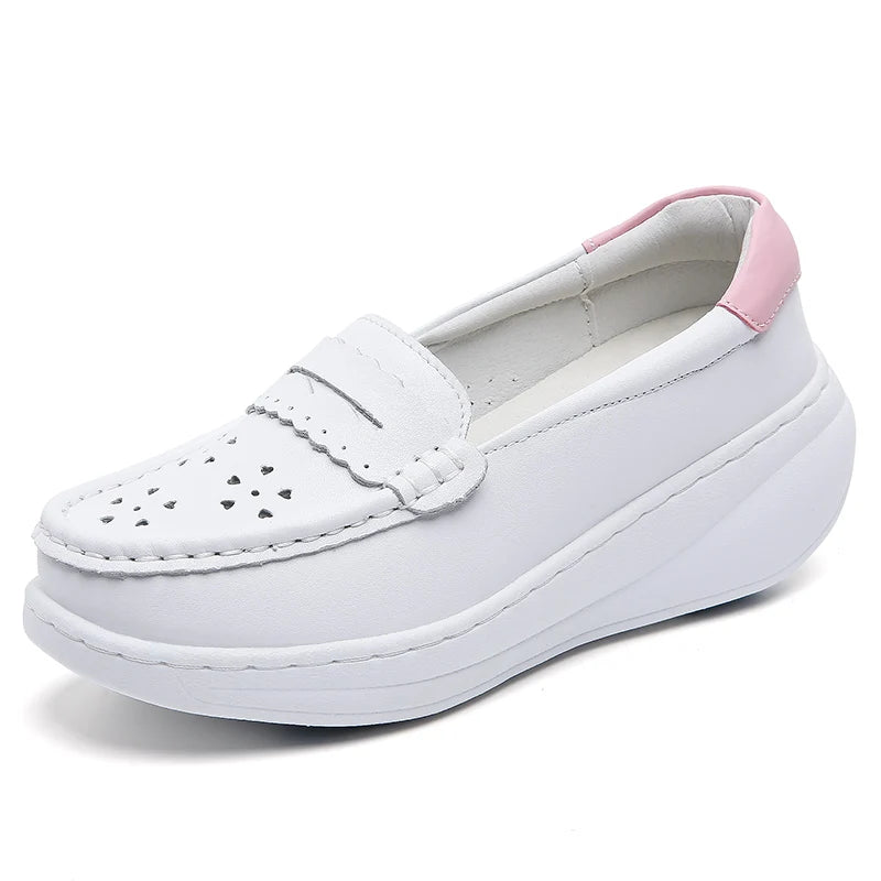 Platform sole detail of white loafer