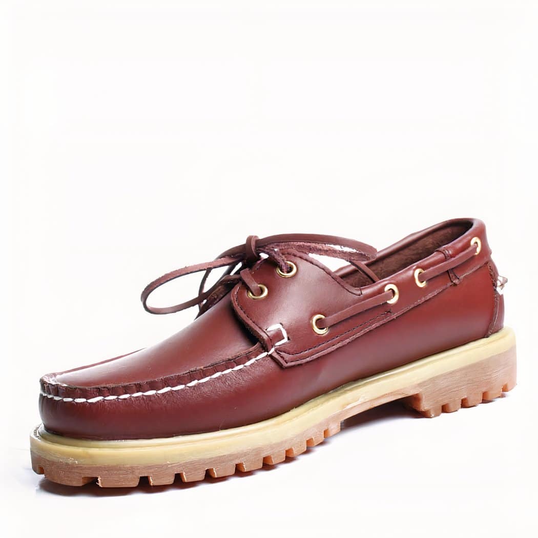 Photo of a brown boat moccasin on a white background