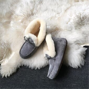 Winter Indian moccasin in grey suede on fur rug