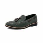 Green suede loafer with tassel on white background