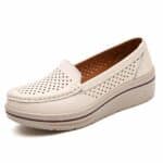 Photo of a white leather moccasin on a white background