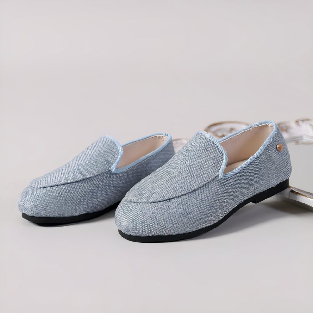 Photo of blue denim loafers with pointed toe