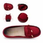 red suede moccasin on women's feet