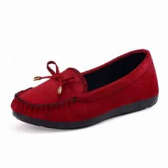 moccasin in red suede with a tassel on the front, set on a white find