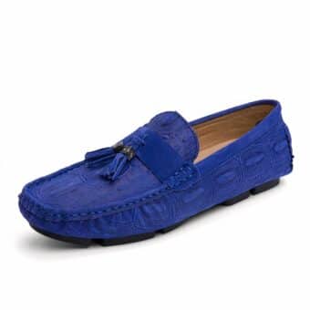 Blue tassel and suede loafer on white background