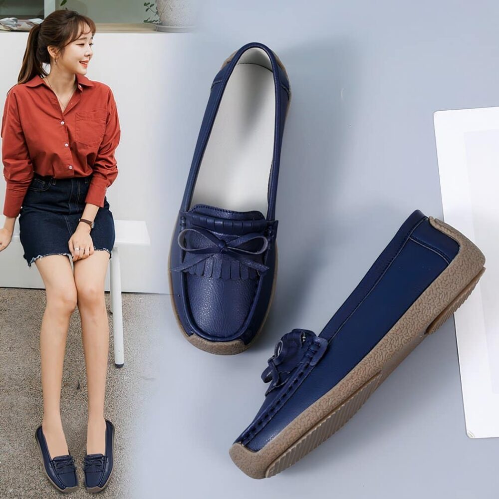blue leather moccasin worn by a woman