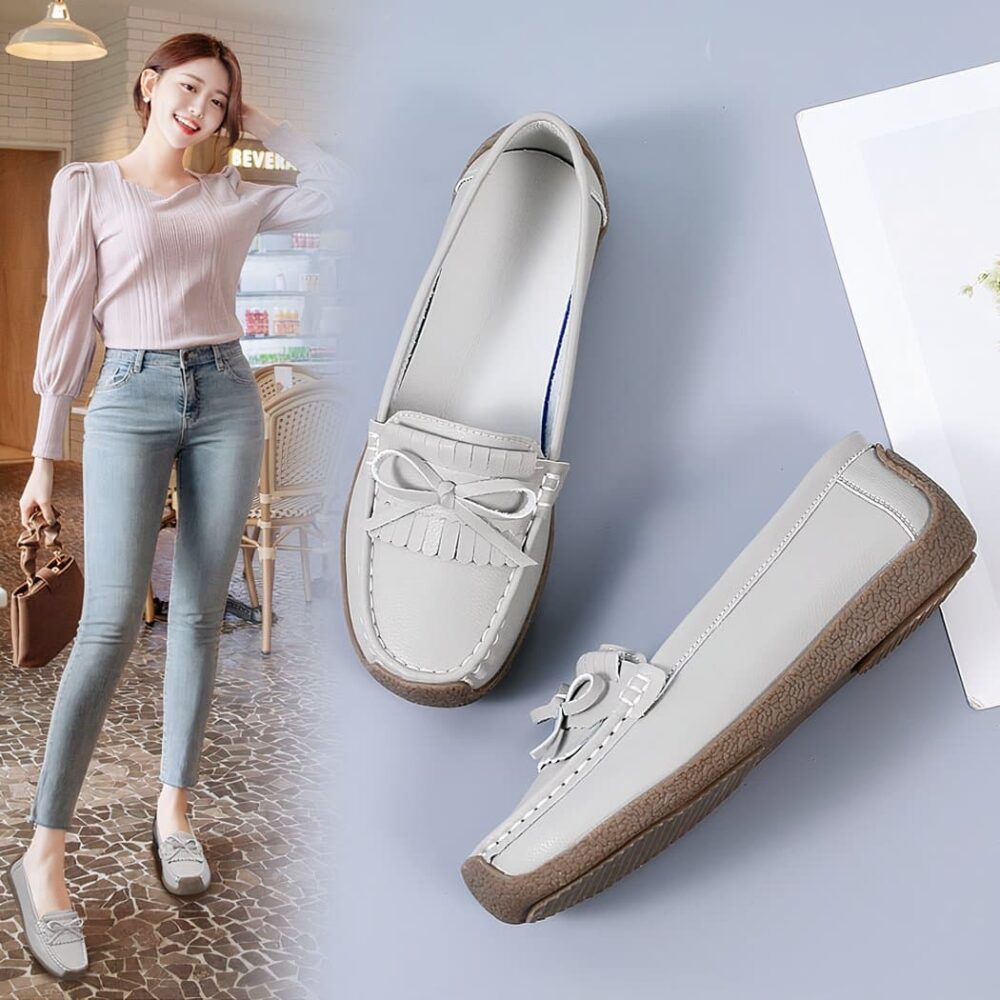 grey leather moccasin worn by a woman