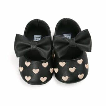 black leather moccasin with hearts
