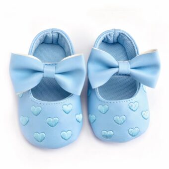 Blue baby moccasin with heart motif and bow tie