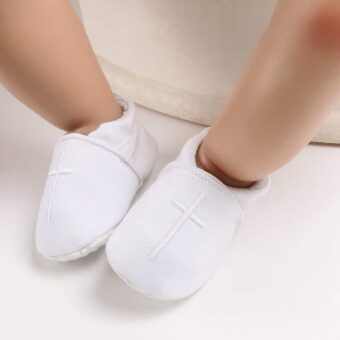 White cotton baby christening moccasins with embroidered cross on top