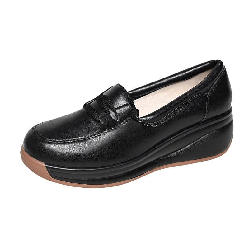 Photo of a black wedge loafer on a white background