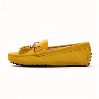Photo of a yellow moccasin on a white background