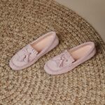 pair of pink fringed moccasins