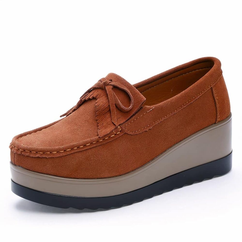 Brown platform loafer on white background.