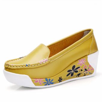 Photo of a yellow wedge loafer on a white background