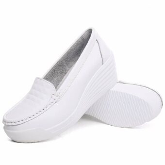 Photo of a pair of white platform loafers on a white background