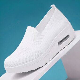 White shoe on white base with turquoise background