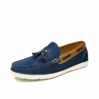 Blue boat moccasin with white sole and brown ankle trim on white background