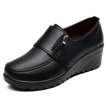 Black loafer in profile with small side zipper