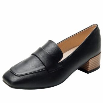Black square-heeled loafers on a white background