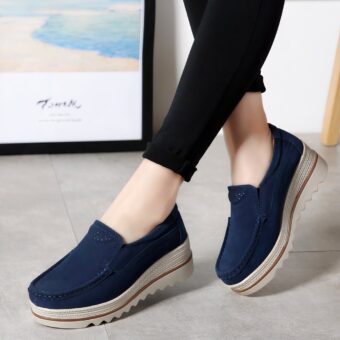 blue faux suede wedge loafer worn by a woman