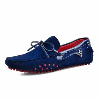Blue moccasin with bow on white background.