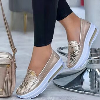 Photo of shiny gold wedge loafer sneakers