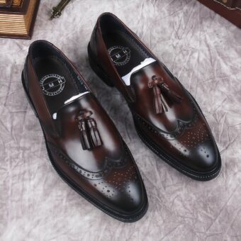 Men's brown genuine leather tassel loafers with grey background