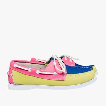 Yellow, pink and blue boat moccasins, placed in profile on a grey floor