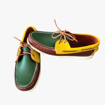 Yellow-green and brown loafers on a grey sofa
