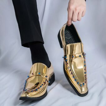 Luxurious brogue-style gold loafers for men with white background